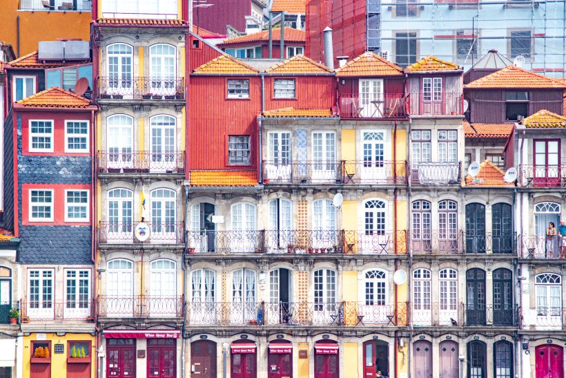 Colourful, historic building with erder and skylights in an urban environment.